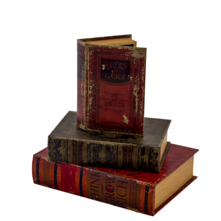A set of three antique-style book storage boxes stacked on top of each other, with visible signs of wear and a magnetic closure visible on the top book.