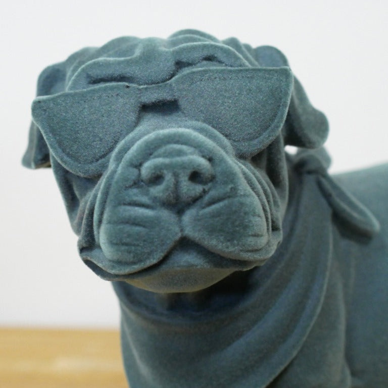 Meet the Blue Resin Bulldog, a bold blend of charm and attitude that commands attention! Crafted with a grey-blue velvet finish, this figurine adds a daring edge to any room, effortlessly complementing modern, maximalist or eclectic styles. More than decor, it’s a quirky guardian that brings warmth and a touch of nostalgia, making your space uniquely inviting. Perfect for those who dare to stand out!