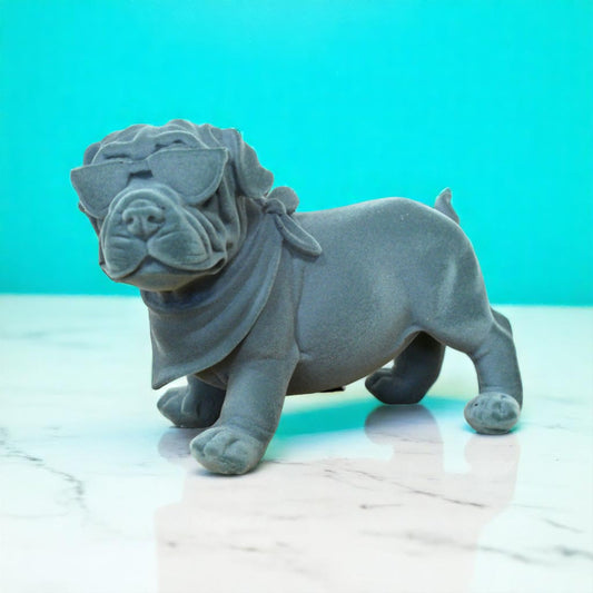Meet the Blue Resin Bulldog, a bold blend of charm and attitude that commands attention! Crafted with a grey-blue velvet finish, this figurine adds a daring edge to any room, effortlessly complementing modern, maximalist or eclectic styles. More than decor, it’s a quirky guardian that brings warmth and a touch of nostalgia, making your space uniquely inviting. Perfect for those who dare to stand out!