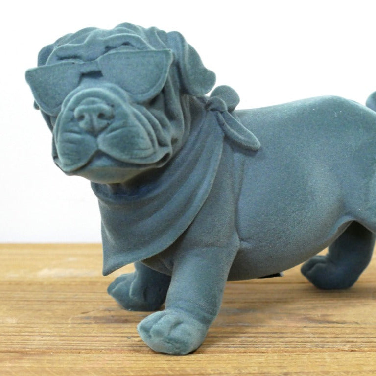 Meet the Blue Resin Bulldog, a bold blend of charm and attitude that commands attention! Crafted with a grey-blue velvet finish, this figurine adds a daring edge to any room, effortlessly complementing modern, maximalist or eclectic styles. More than decor, it’s a quirky guardian that brings warmth and a touch of nostalgia, making your space uniquely inviting. Perfect for those who dare to stand out!