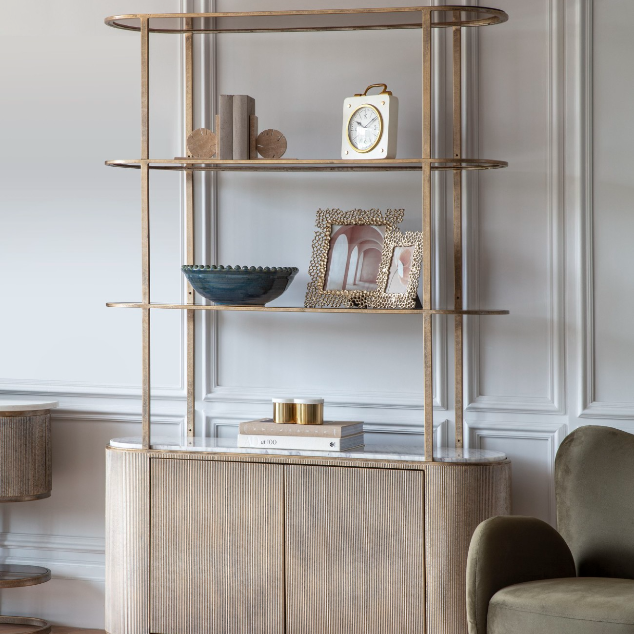 Modern interior with a decorative shelf and sideboard against a wall.