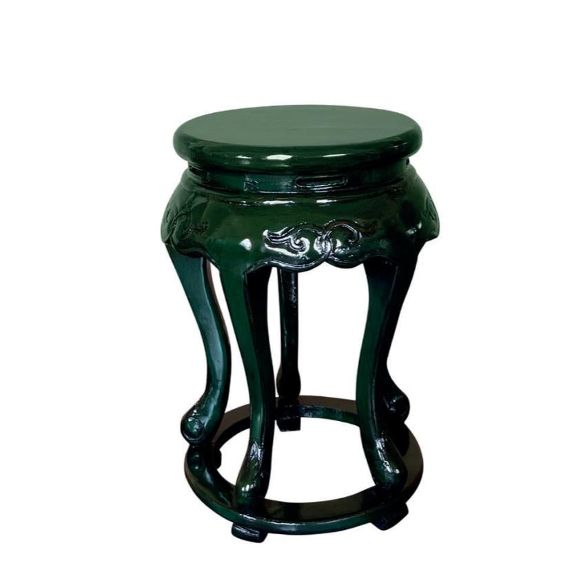 Crafted from exquisite elm wood and finished in a rich, deep green, this Chinoiserie stool commands attention with its bold oriental flair. Its unique design and intricate details transform any room into a statement of daring elegance. Perfect for those who dare to stand out.