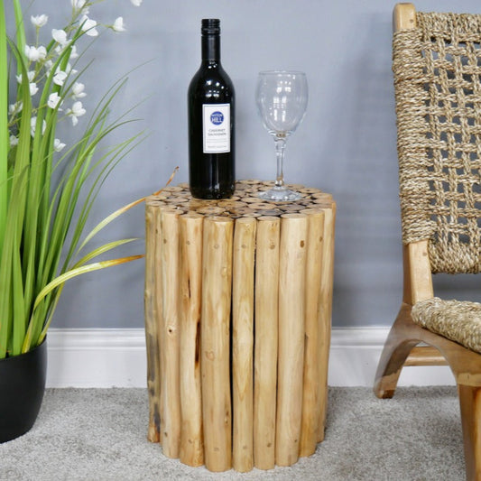 Crafted from natural teak wood, this Coastal Teak Side Table boldly celebrates natural beauty with its unique assembly of wooden tubes. Its raw, untouched finish brings an authentic rustic charm to any living space, and it can even double up as a stool. Perfect for those who dare to embrace a beach house vibe, this piece adds character and warmth.