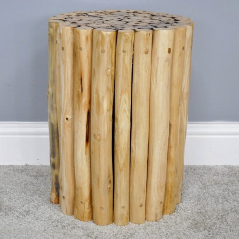 Crafted from natural teak wood, this Coastal Teak Side Table boldly celebrates natural beauty with its unique assembly of wooden tubes. Its raw, untouched finish brings an authentic rustic charm to any living space, and it can even double up as a stool. Perfect for those who dare to embrace a beach house vibe, this piece adds character and warmth.