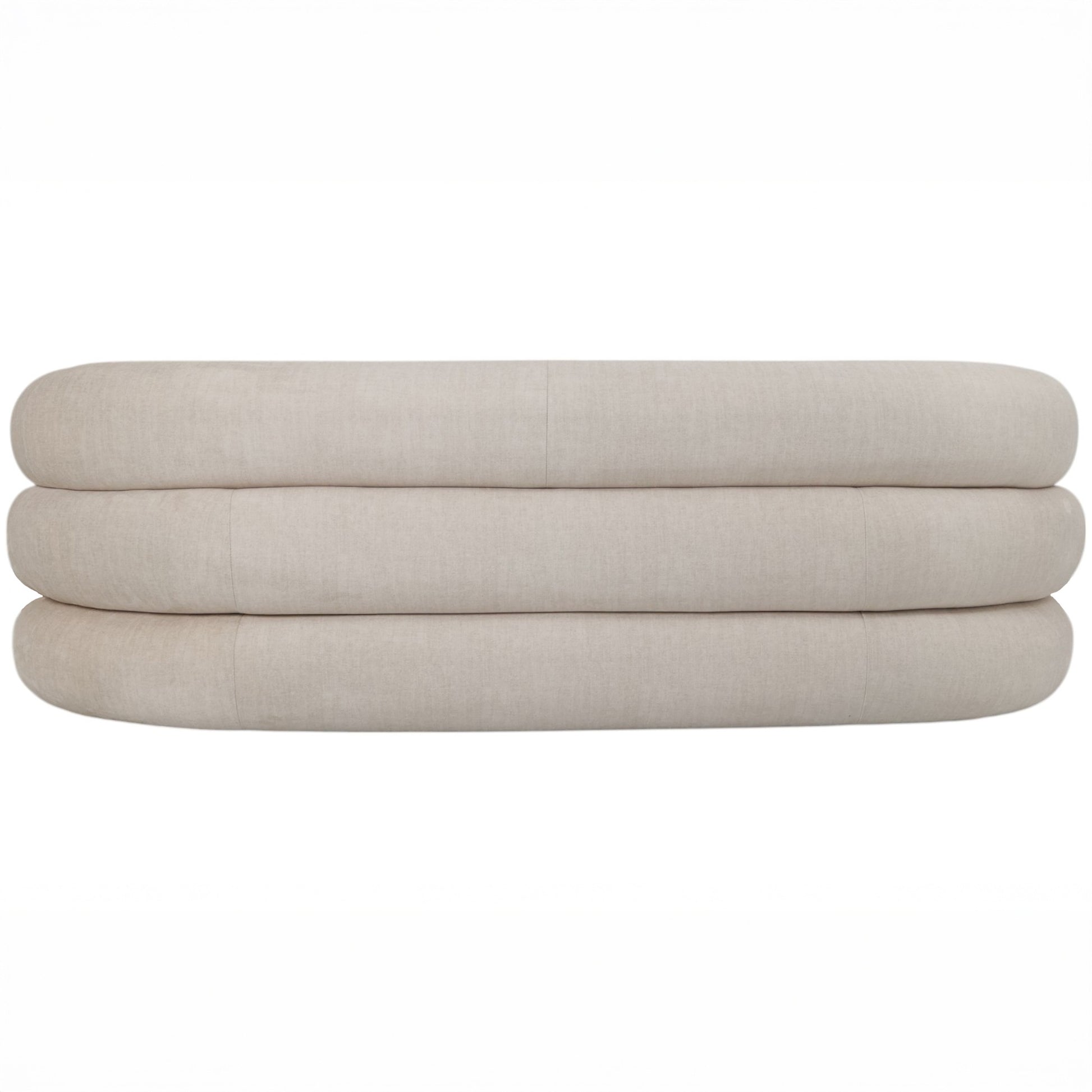 Back of a curved cream velvet sofa on a white background