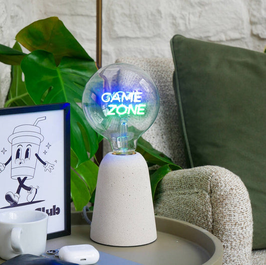 A filament screw down E27 bulb with green and blue text reading 'Game Zone'