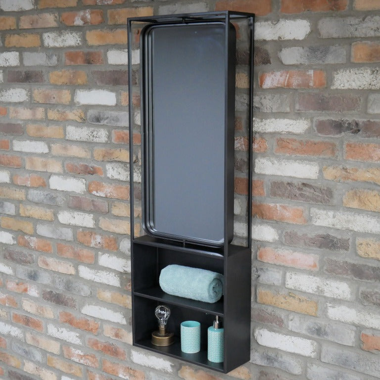 Keep your home stylishly organised with our Industrial Black Wall Mirrored Unit! This large rectangular shelf boasts a sleek black metal finish that screams industrial chic. Two spacious shelves are just begging to showcase your favourite things, and the built-in mirror at the top also adds that perfect rustic flair. With easy-to-use hooks for mounting, this playful piece will jazz up any bathroom, hallway, or kitchen!