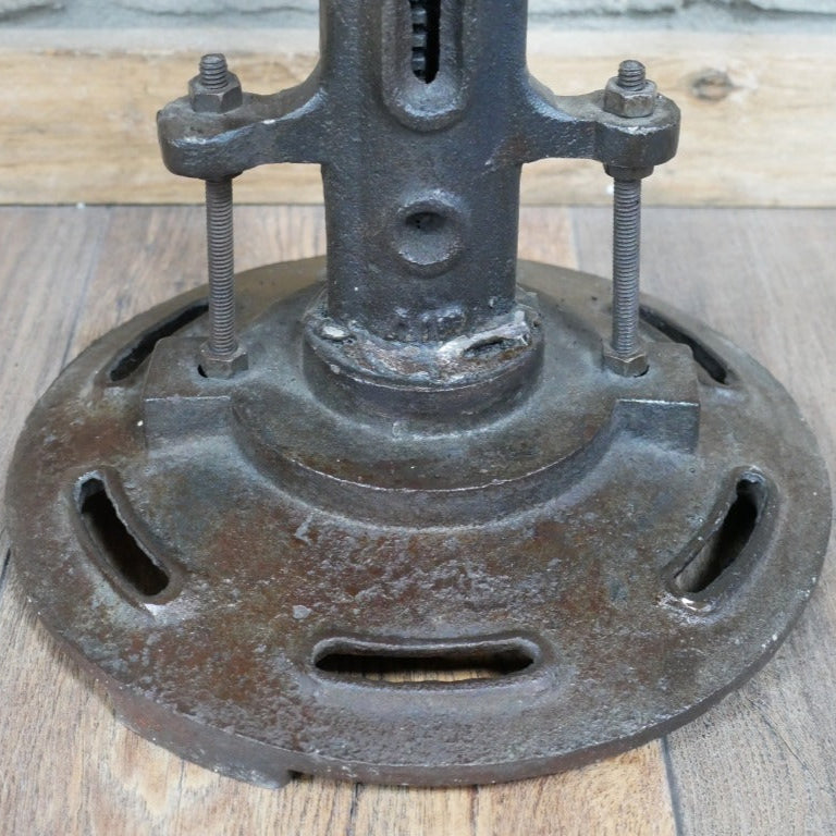 Adjustable-height industrial stool with a round mango wood seat and black iron base, measuring 30cm in diameter. The seat height ranges from 46cm to 60cm, allowing for versatile use. The stool's minimalist design and combination of natural wood and metal materials make it suitable for various interior styles, including industrial, rustic, and contemporary decors.