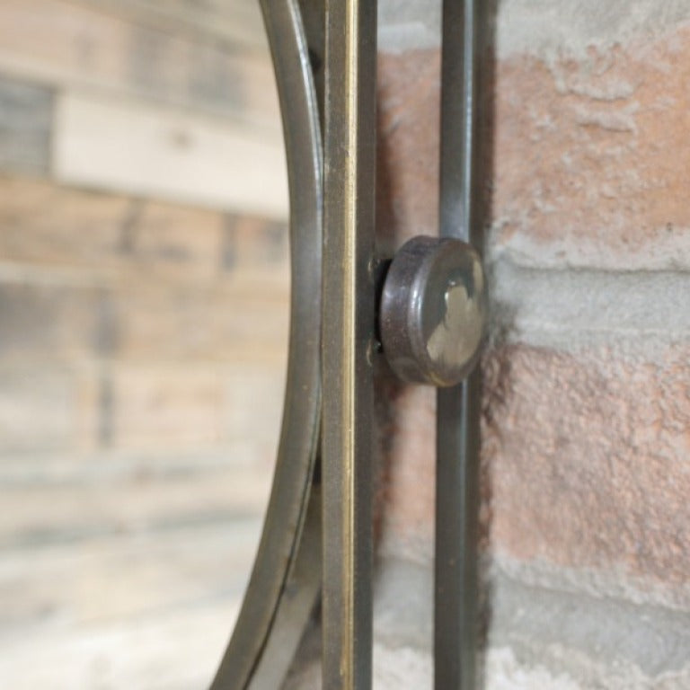 Make a bold statement with this Industrial Framed Wall Mirror. Its unique distressed bronze finish and striking circular mirror set inside a square frame deliver a daring, weathered industrial vibe that transforms any room into a standout space.