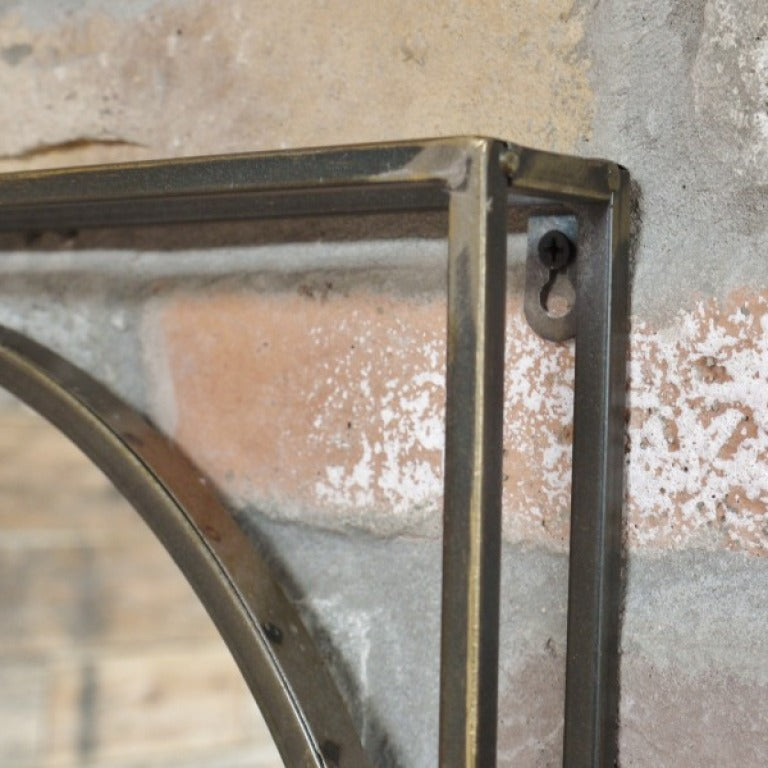 Make a bold statement with this Industrial Framed Wall Mirror. Its unique distressed bronze finish and striking circular mirror set inside a square frame deliver a daring, weathered industrial vibe that transforms any room into a standout space.