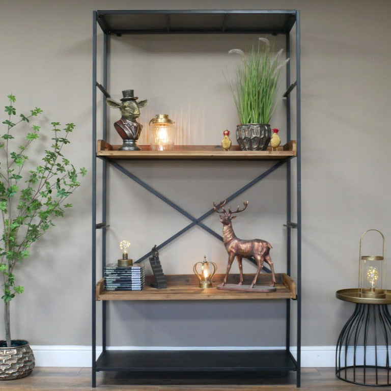 Tall industrial-style shelving unit measuring 200cm in height, 110cm in width, and 40cm in depth. Constructed with a sturdy black iron frame and five spacious reclaimed wood shelves, the unit showcases a blend of rustic and industrial aesthetics. The natural wood finish highlights the unique grain patterns, while the metal framework provides durability and a contemporary edge. This versatile piece complements various interior styles, including industrial, rustic, and modern farmhouse decor styles.