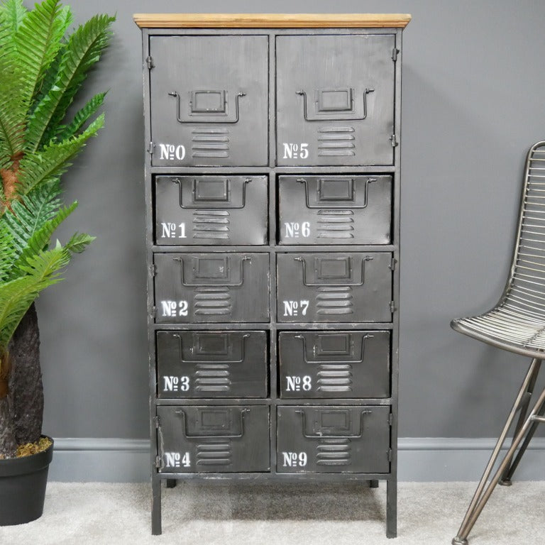 Tall industrial-style cabinet measuring 111cm in height, 56cm in width, and 34cm in depth. Constructed with a metal frame and a rustic wooden top, this piece features eight drawers and two doors, all finished with a distressed look. The combination of metal and wood elements gives it a vintage industrial aesthetic, making it suitable for various interior styles, including loft, industrial, and rustic decors.
