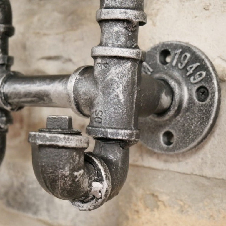 Crafted from genuine steel, this Industrial Pipe Coat Hook set injects a bold steampunk vibe into any space. With five sturdy hooks, they offer practical storage while transforming your walls with an edgy, industrial flair. Perfect for those who dare to redefine their home decor and want to say goodbye to boring coat organisation!