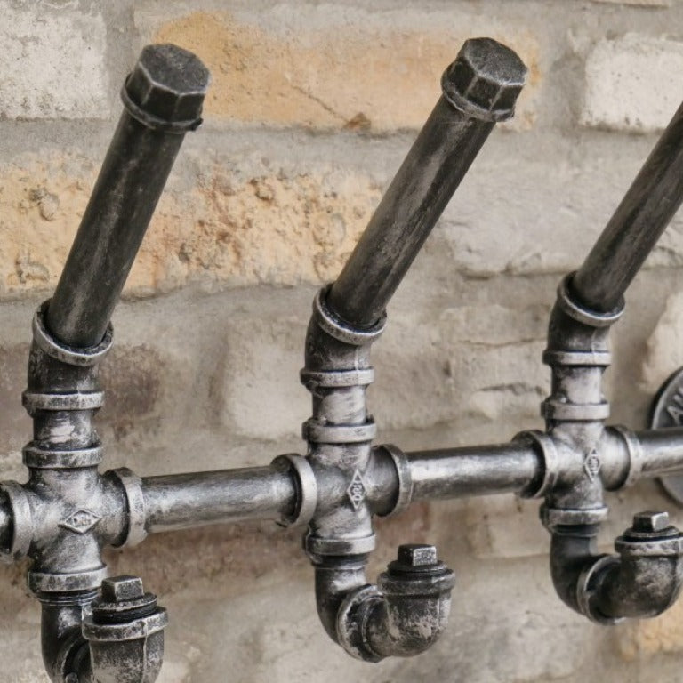 Crafted from genuine steel, this Industrial Pipe Coat Hook set injects a bold steampunk vibe into any space. With five sturdy hooks, they offer practical storage while transforming your walls with an edgy, industrial flair. Perfect for those who dare to redefine their home decor and want to say goodbye to boring coat organisation!