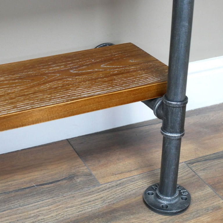 This Industrial Pipe Hallway Shelf goes above and beyond with its bold steel grey metal pipe design, injecting a daring urban vibe into your entryway! Featuring four round fixing plates, it secures firmly to your wall while bringing raw industrial charm. Two rustic reclaimed wood shelves at the base provide practical shoe storage, making this piece both unique and functional. Upgrade your storage game!
1.95 metres tall.