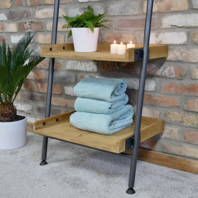Add a warm, industrial touch to your space with this Industrial Leaning Mirror Shelf. Crafted from reclaimed wood, featuring three shelves and a hanging rail. Its rustic charm and natural imperfections bring character to any room, whether in your study, bathroom, or bedroom. This versatile piece combines practical storage with stylish design, helping you keep your essentials organised and within easy reach!