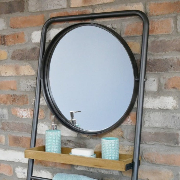 Add a warm, industrial touch to your space with this Industrial Leaning Mirror Shelf. Crafted from reclaimed wood, featuring three shelves and a hanging rail. Its rustic charm and natural imperfections bring character to any room, whether in your study, bathroom, or bedroom. This versatile piece combines practical storage with stylish design, helping you keep your essentials organised and within easy reach!