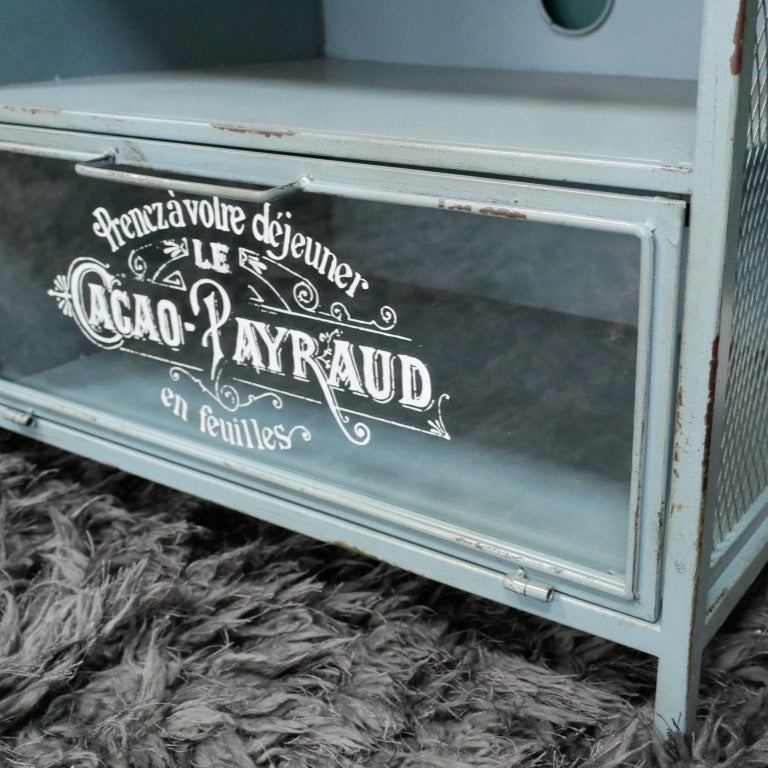 Elevate your living space with this Industrial Wood TV Bench, crafted from sturdy metal and blue-painted reclaimed wood. Designed to offer ample storage, it features drawers and cupboards; perfect for organising your TV accessories. A pre-cut round hole keeps wires tidy, while the spacious counter-top accommodates both small and wide-screen TVs, combining practicality with industrial charm! Ideal for rustic, industrial, or even coastal inspired home decor due to its soft blue colour.
