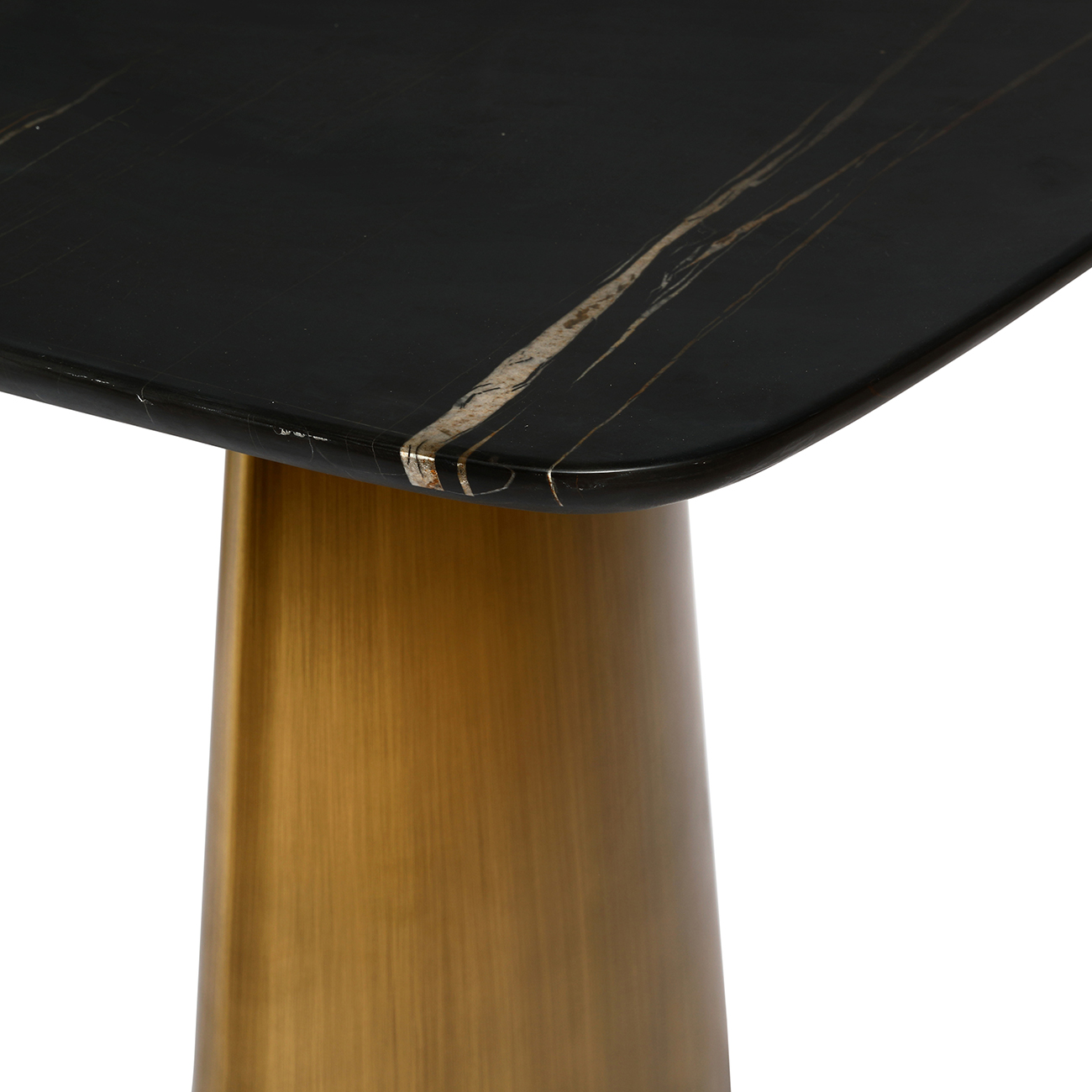 Close-up of a black marble table top with a gold metal base on a white background