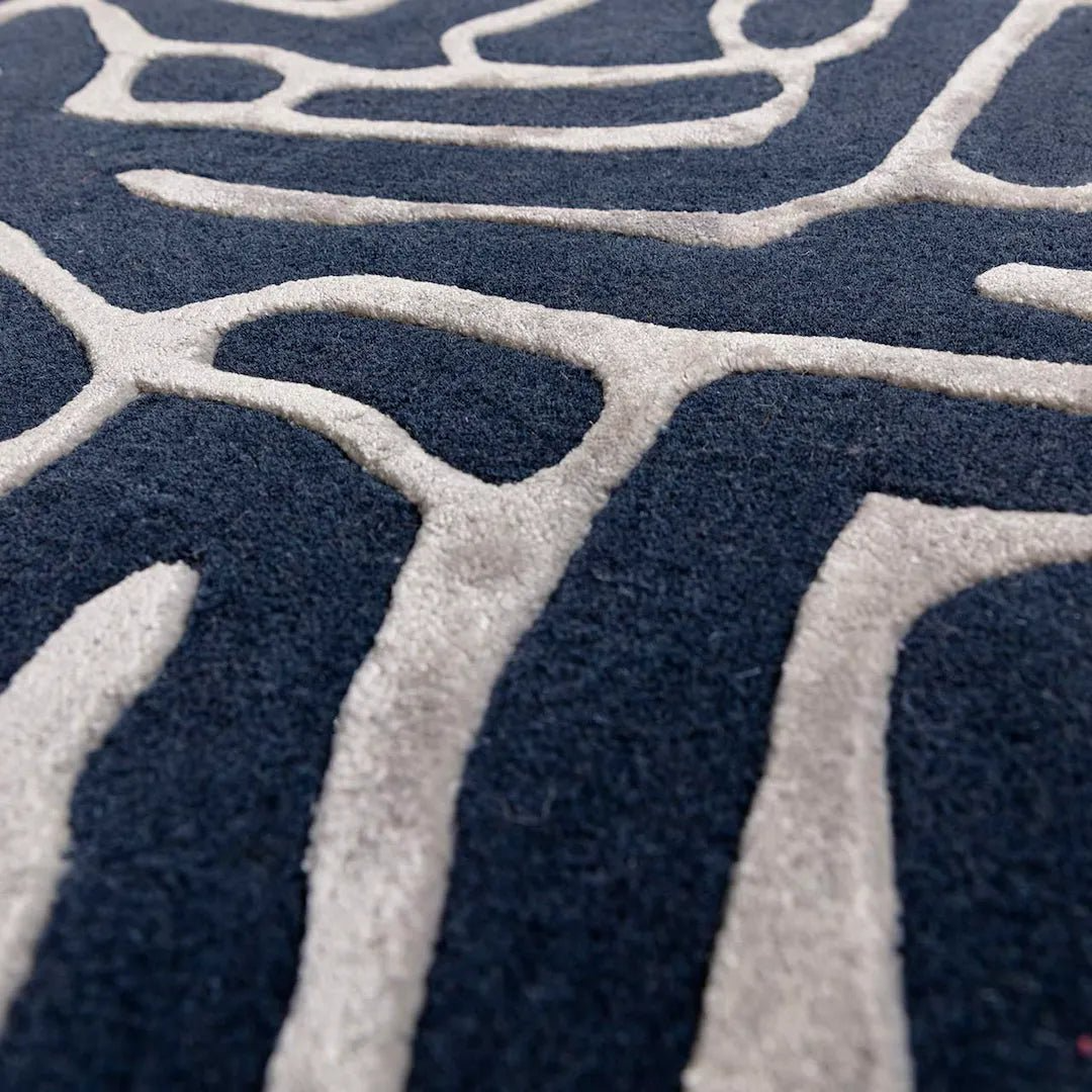 Close-up of a navy blue and white patterned rug