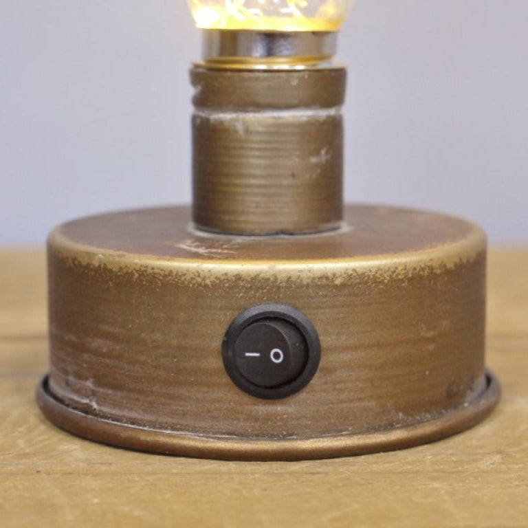 Illuminate your space with the Rustic Brass-Look Bulb Light. Powered by 2 AA batteries, it offers a warm, inviting glow that enhances any room. The industrial-style weathered finish adds a rustic charm, making it a stylish and versatile addition to your decor. Easy to move and place, it helps create a cosy, welcoming atmosphere wherever you choose!