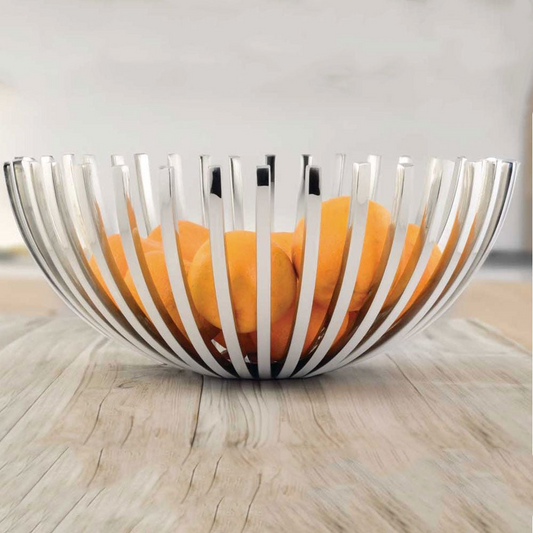 Silver wire fruit bowl with oranges on a wooden surface