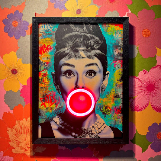 Framed artwork of a woman blowing a bubble with colorful background