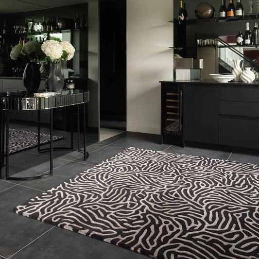 Patterned rug on a dark floor with a modern interior setting