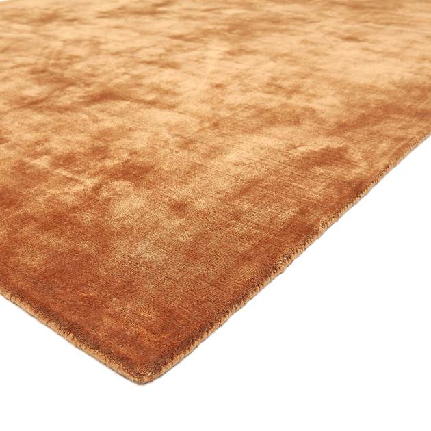copper textured rug on a white background