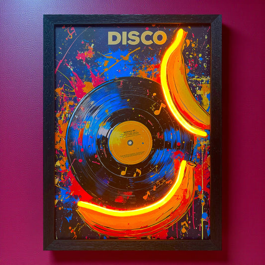 Framed artwork with a vinyl record and neon bananas on a colorful splatter background, labeled 'DISCO'.