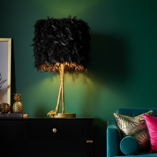 Living room with teal sofa, colorful rug, and decorative lamp against a green wall.