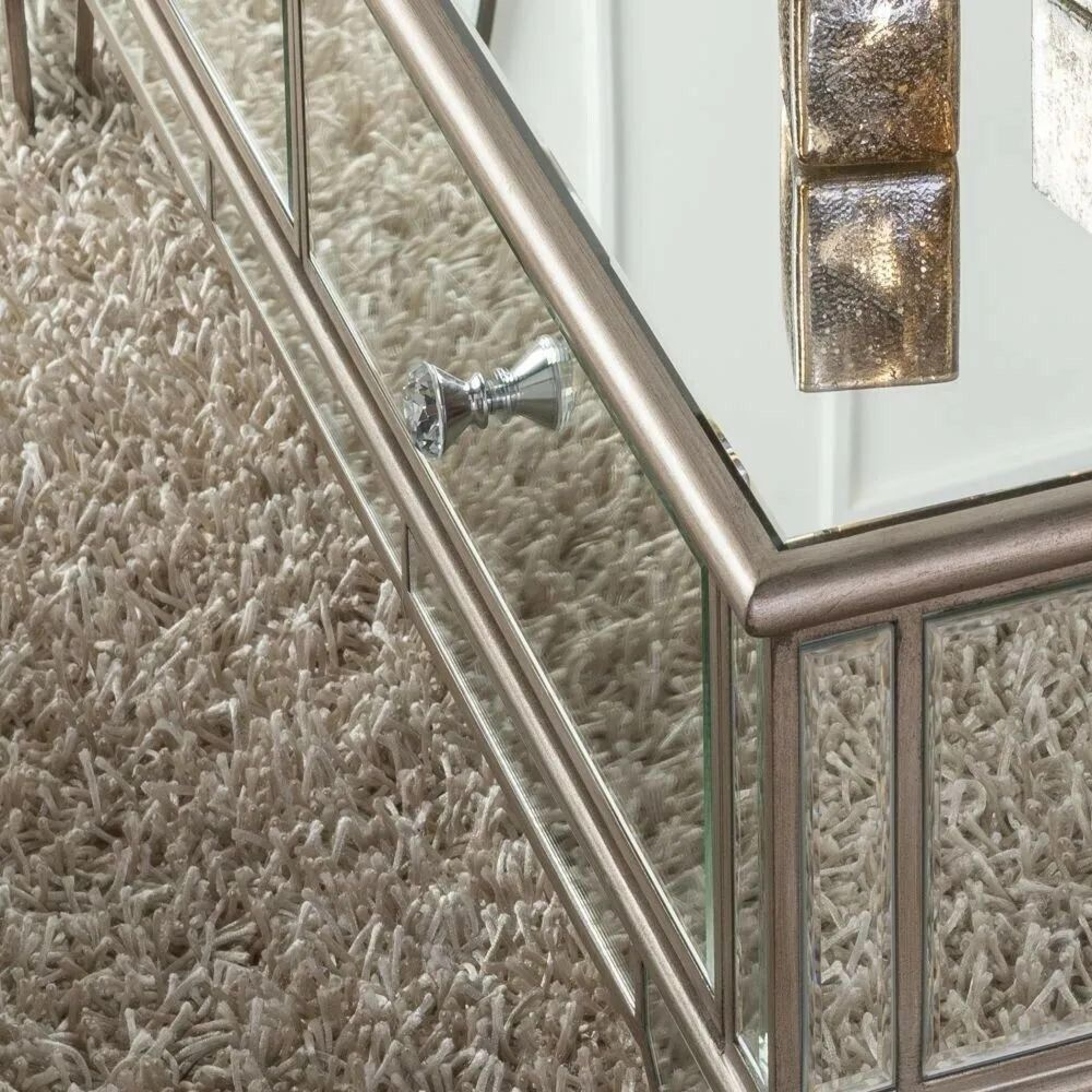 Decorative rectangular coffee table close up with metallic frame on a textured surface