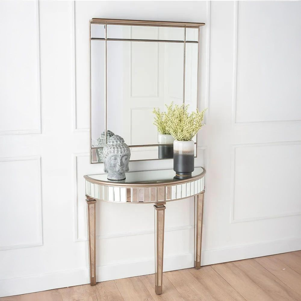 Console table with decorative items against a white wall