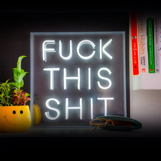 Neon sign with text 'FUCK THIS SHIT' on a dark background