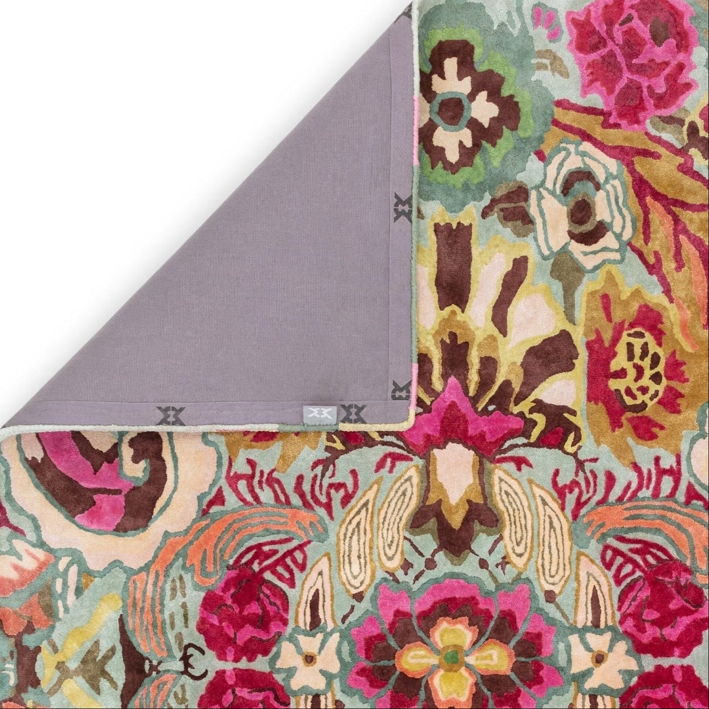 Floral-patterned rug with a gray backing