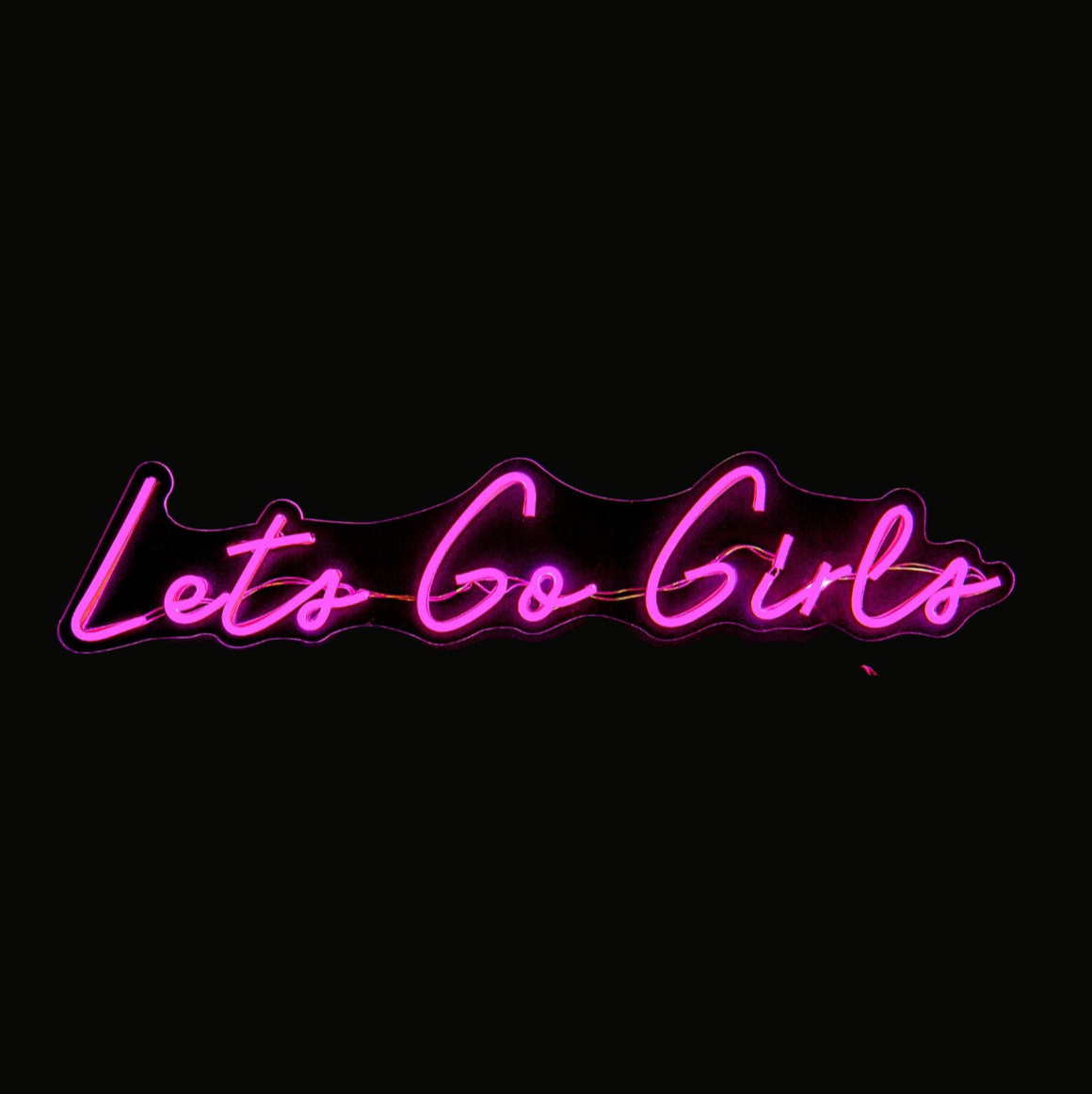 Neon sign with 'Let's Go Girls' text on a black background