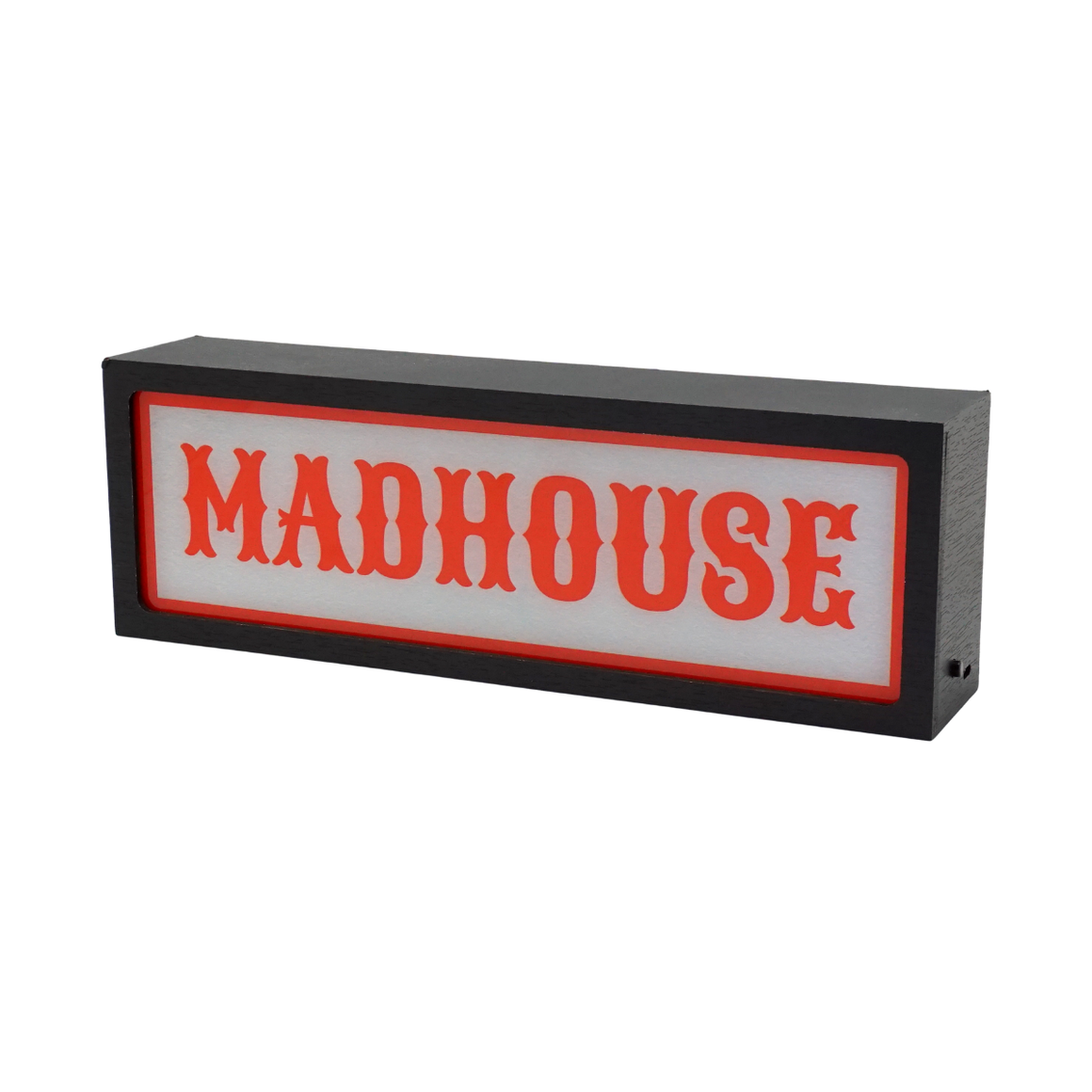 Rectangular sign with 'MADHOUSE' in red text on a white background