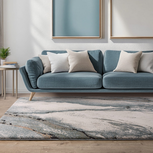 Blue sofa with white cushions in a living room setting