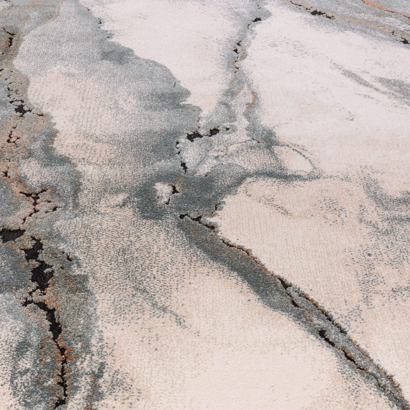 Abstract patterned rug with gray and beige tones