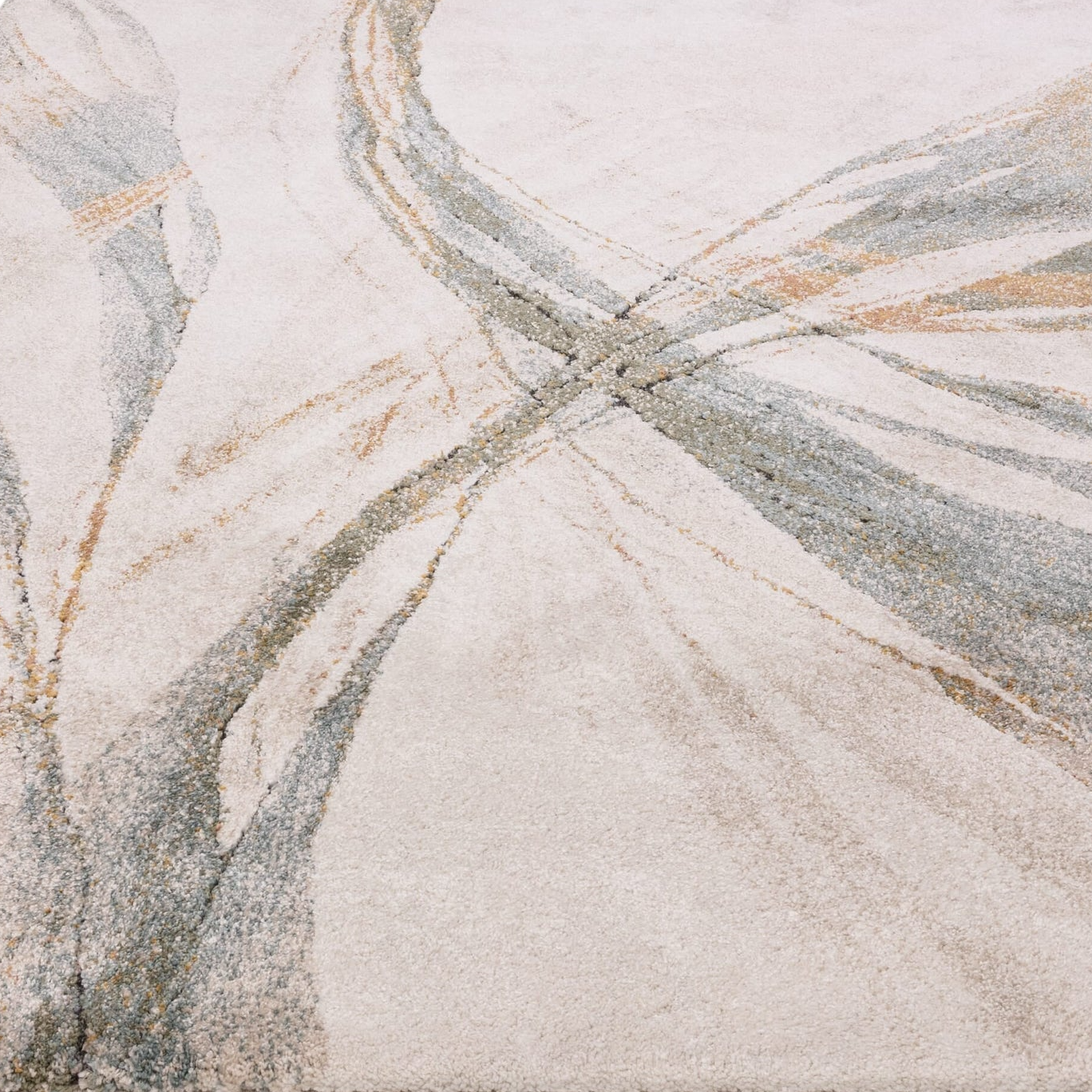 Close-up of a textured rug with abstract design in neutral colors