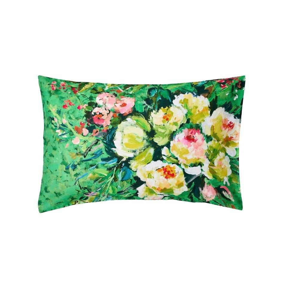 Floral pillow with green background on a white background