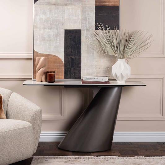 Modern living room with a stylish armchair, console table, and abstract wall art.