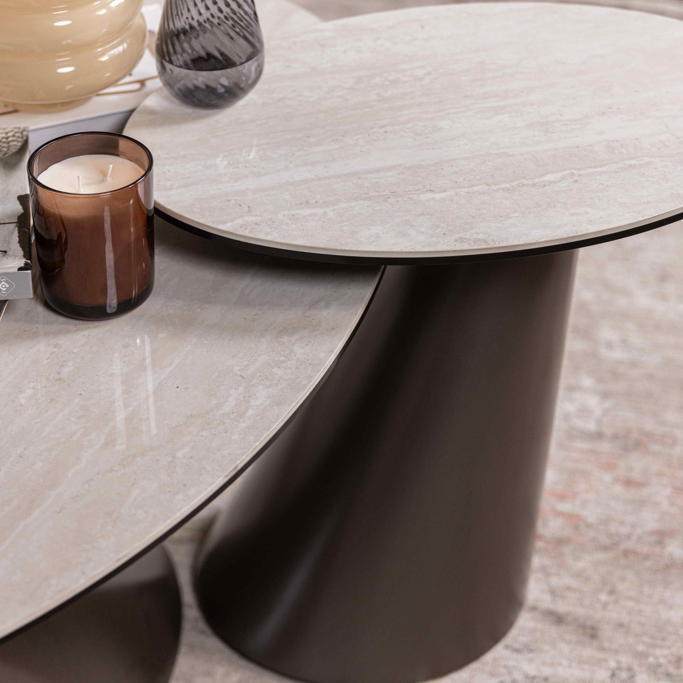 Modern coffee table with decorative items on a neutral background