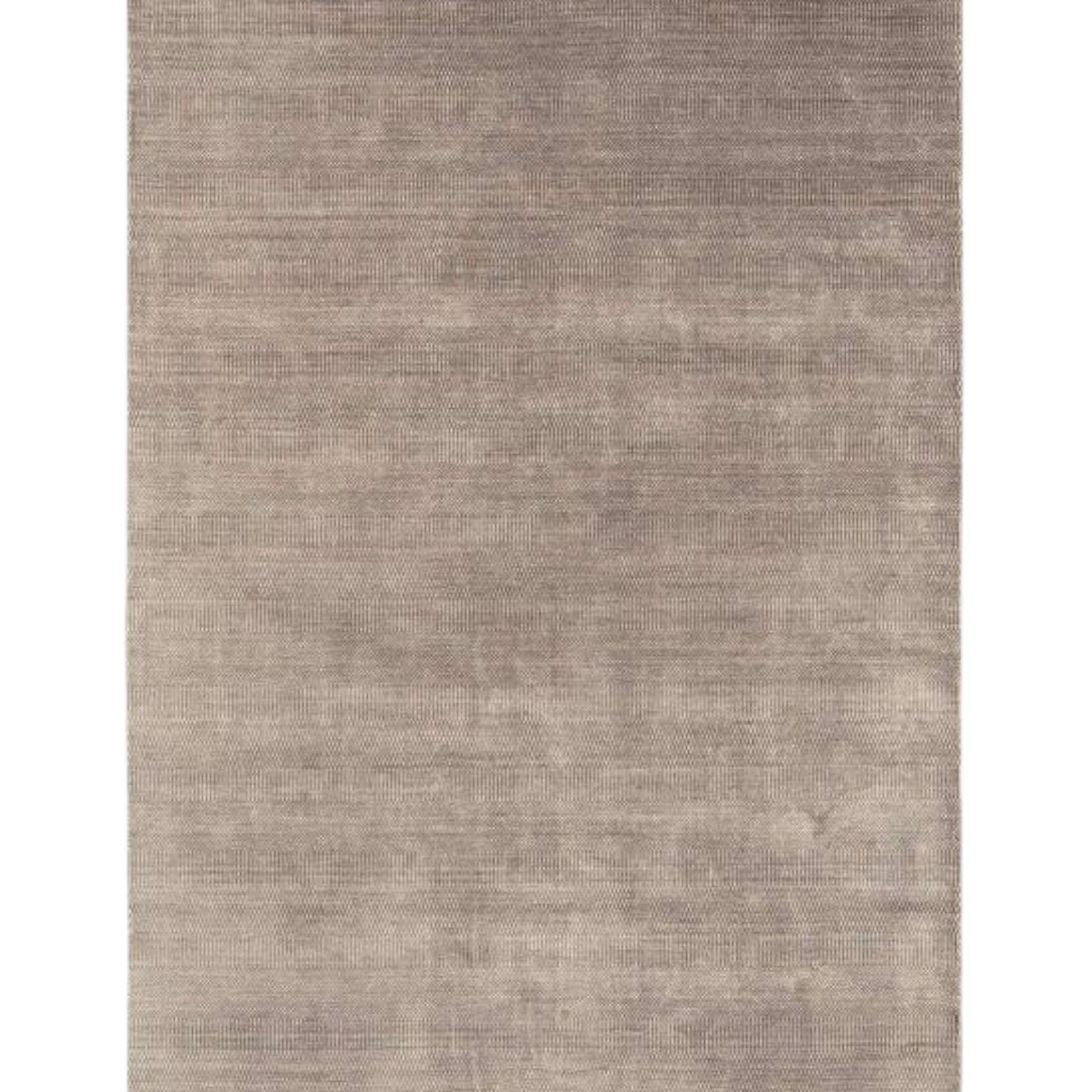 Textured biscuit coloured rug on a white background