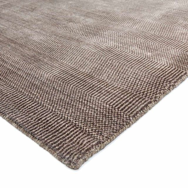Textured brown rug on a white background