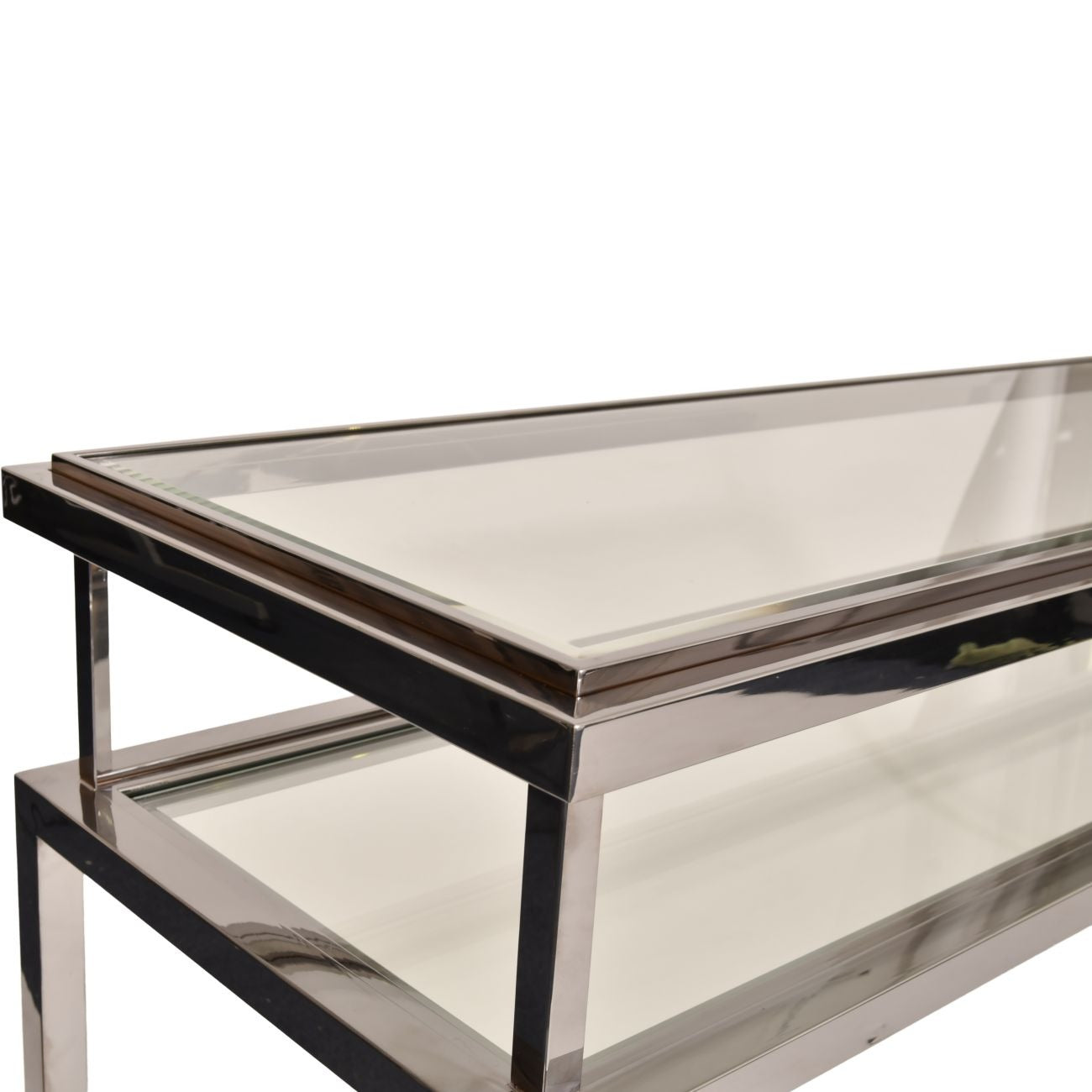 Modern coffee table with glass top and metal frame on a white background