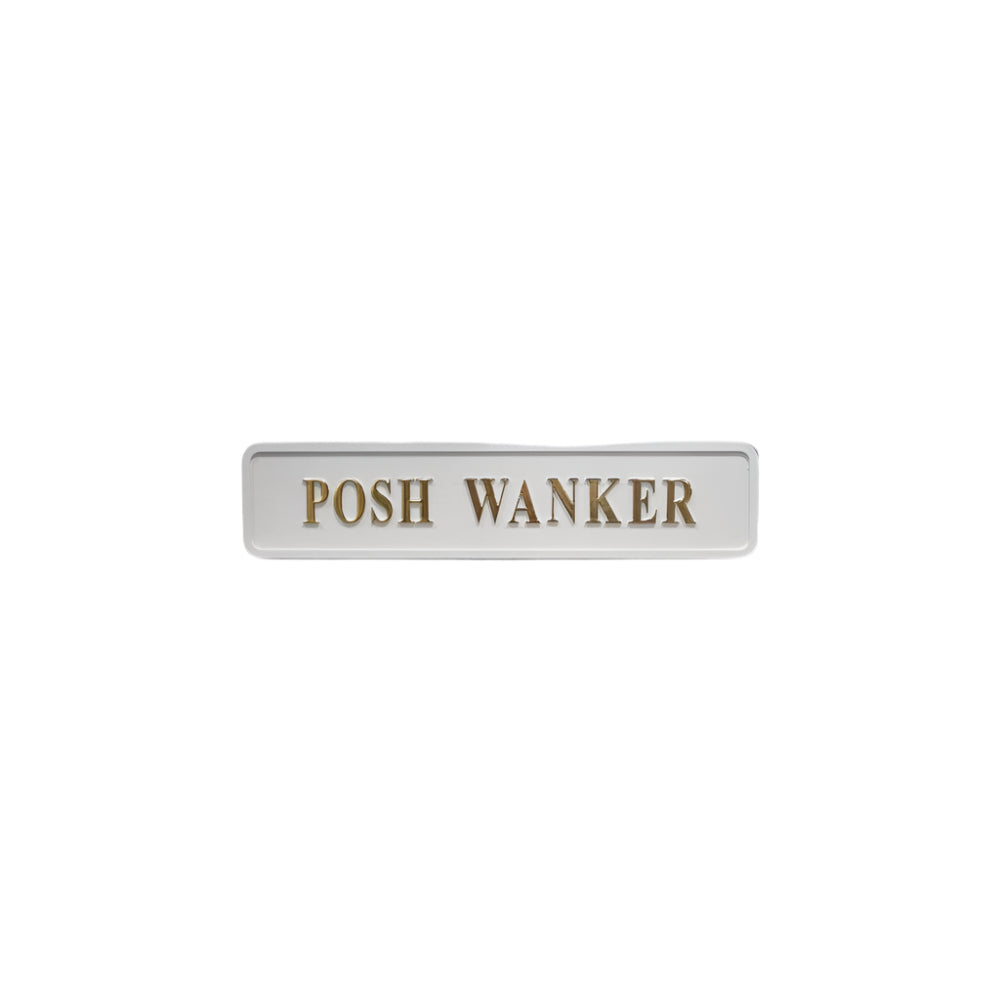 White wooden sign with golden text reading "posh wanker"