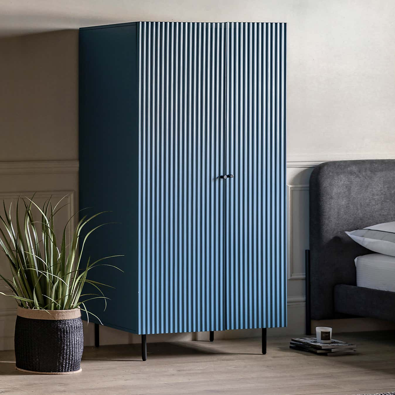 Modern wardrobe with striped design in a bedroom setting