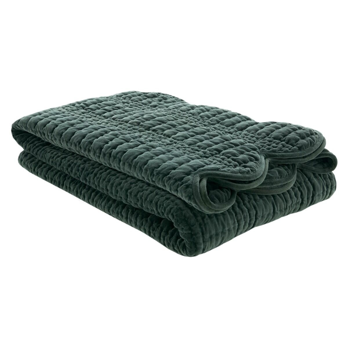 Folded dark green quilt on a white background