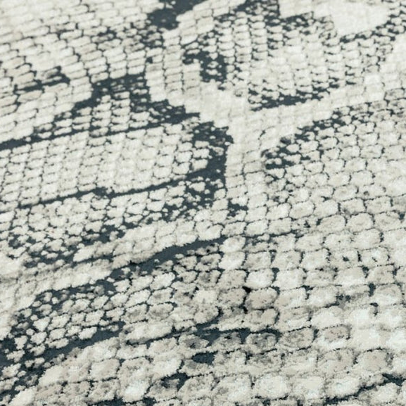 Close-up of a textured rug with a pattern on a white background